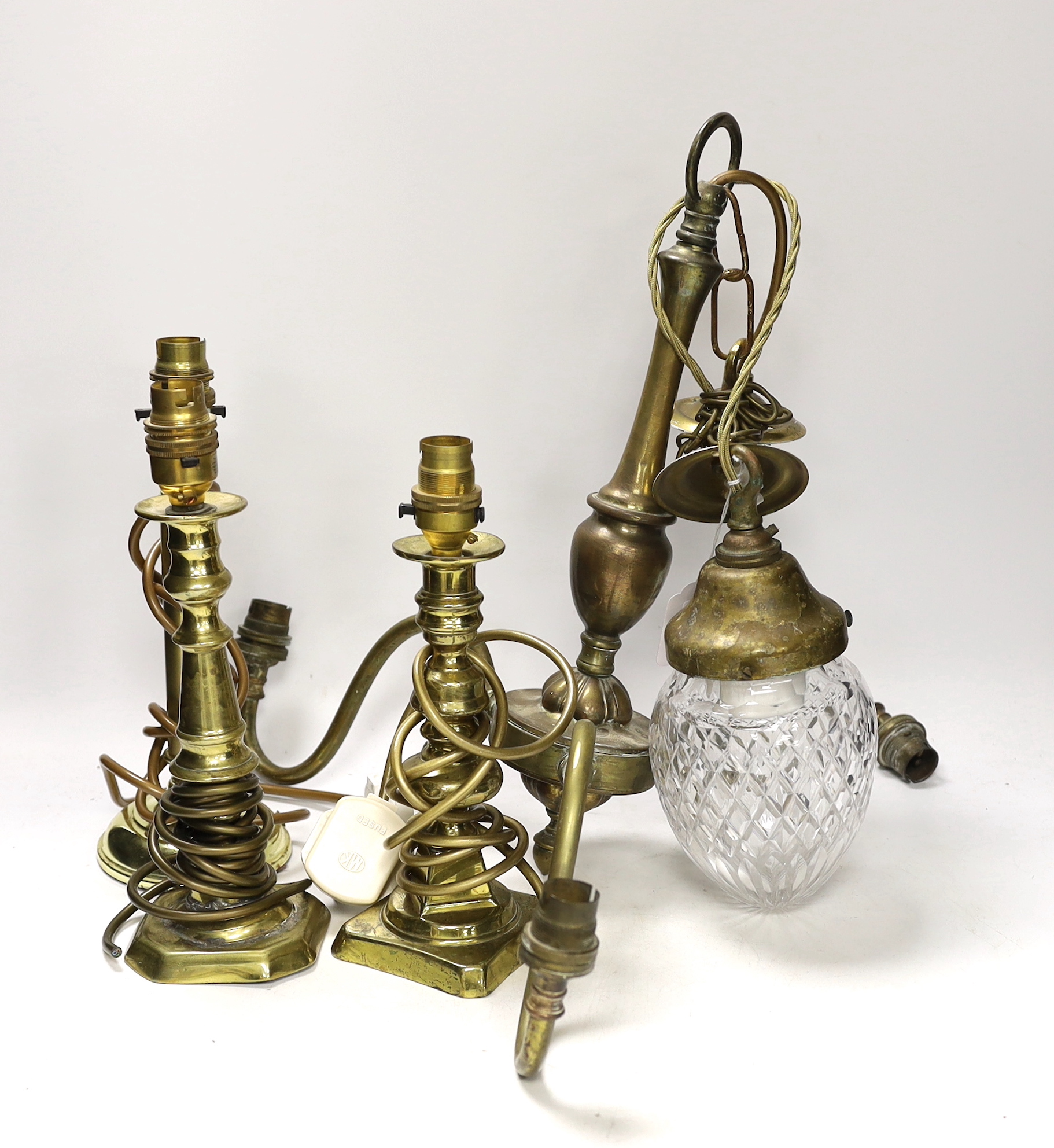 Three brass desk lamps and a three-branch electrolier together with a brass-mounted ceiling light with clear glass shade largest overall 53cm high (5)